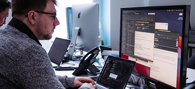 Male colleague looking at support tickets